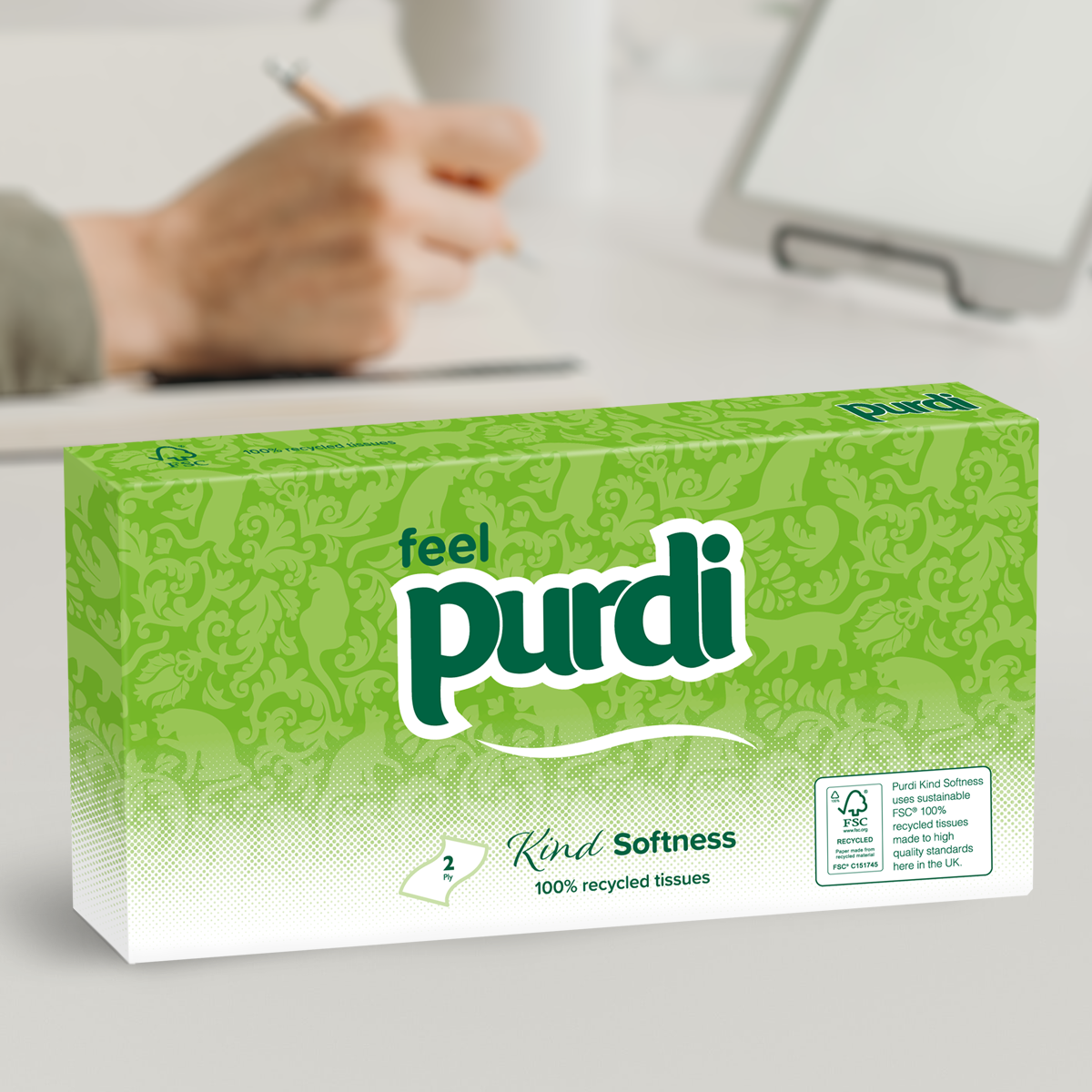 Kind Softness facial tissue package sitting on desk